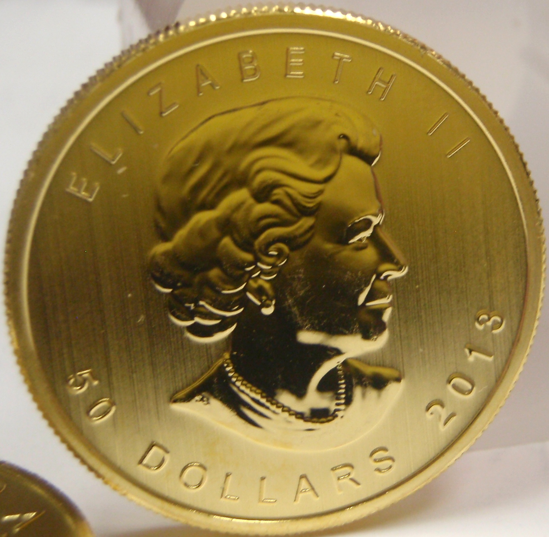 1 oz Gold Maple Leafs Diverse Equities Inc. Calgary, Alberta